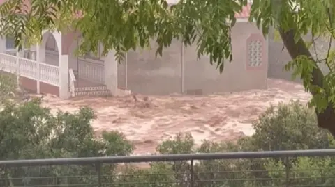 Floods trap people in cars in Spain's Catalonia region
